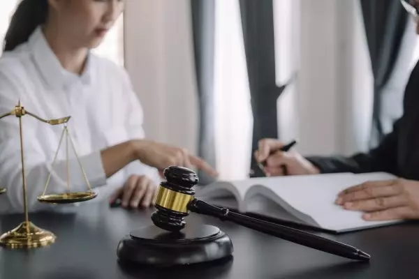 judge-gavel-with-justice-lawyers-having-team-meeting-law-firm-background-concepts-law-legal-services