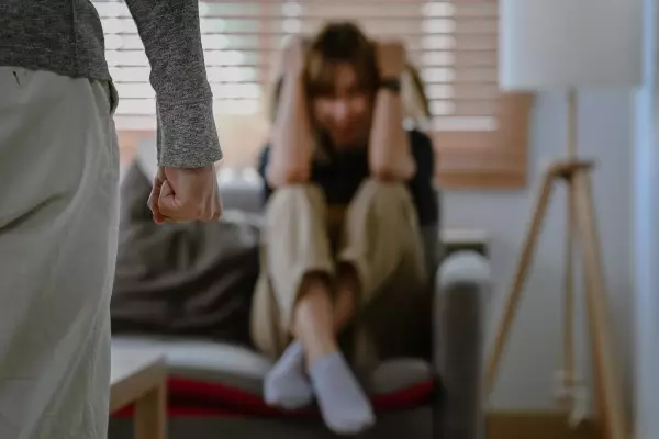 man-clenching-fist-anger-with-crying-woman-background-domestic-family-violence-concept