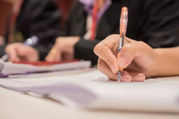 document-hands-holding-pen-checking-signing-white-documents-reports-papers