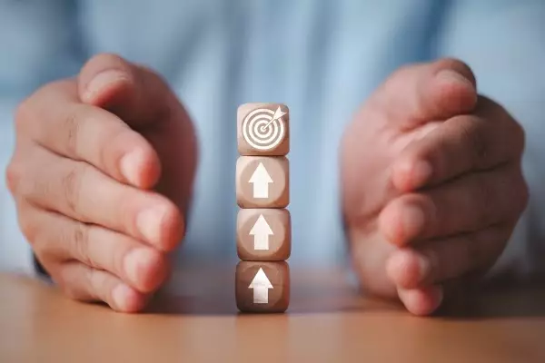 man-hand-protecting-with-increasing-arrow-dartboard-setup-business-objective-target-goal-concept